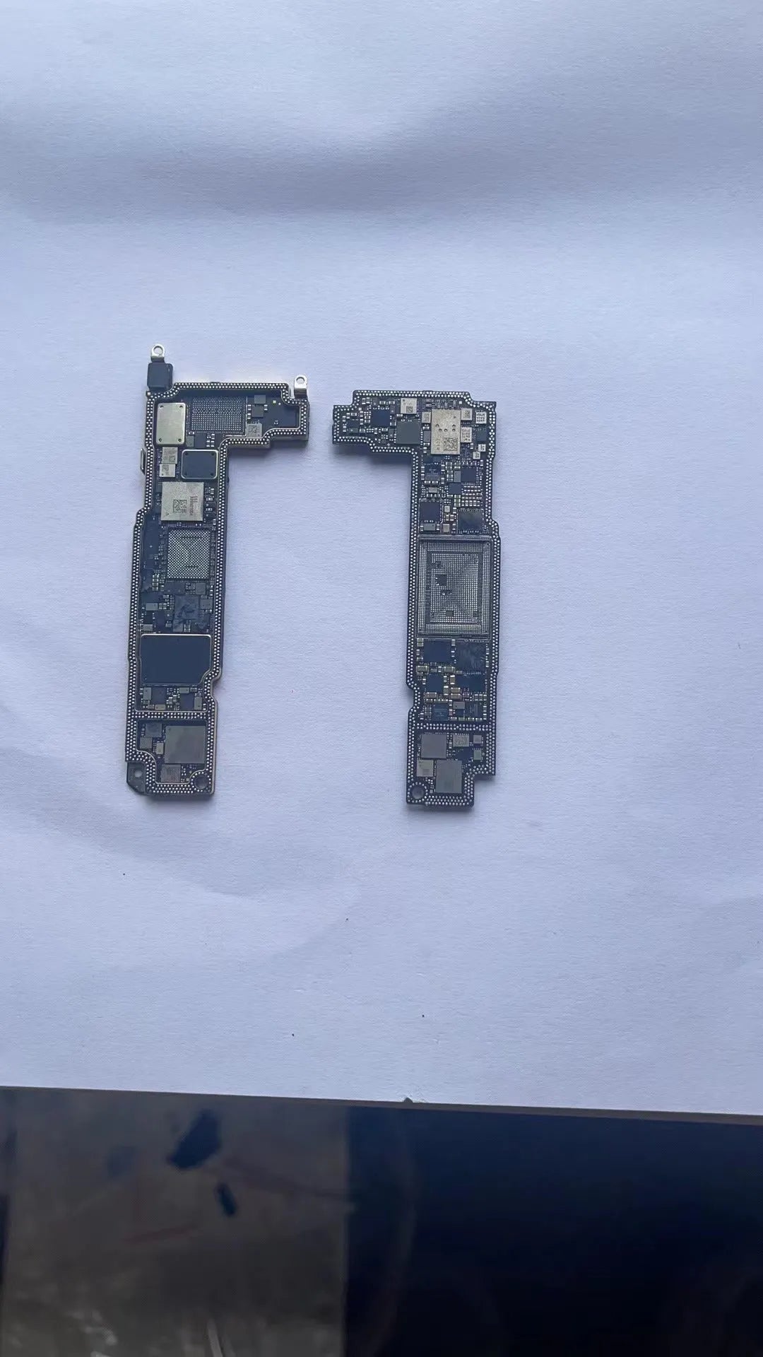 Silver-coloured iPhone logic board replacement part for 12 series models