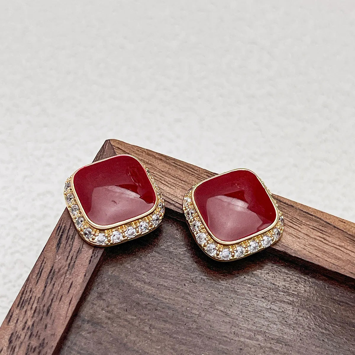 Red geometric square earrings with alloy construction and inlaid design detail