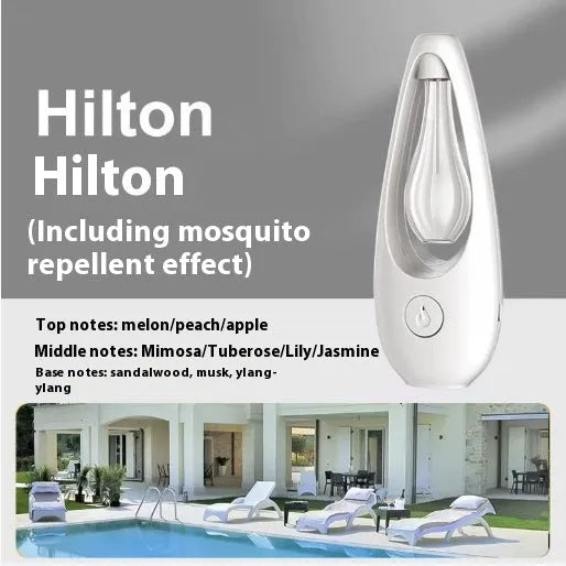 White ultrasonic essential oil diffuser with remote control on a wooden table