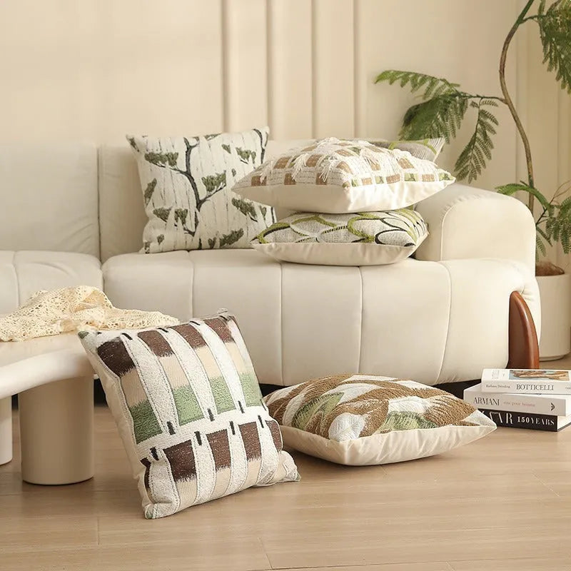 Square jacquard pillow with botanical floral pattern, shown in one of eight available colour options.