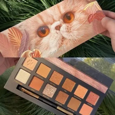 Explorer twelve-colour animal-themed pressed powder eyeshadow palette open showing matte and shimmer shades
