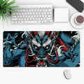 Large customisable anime gaming mouse pad with non-slip rubber base on a desk.