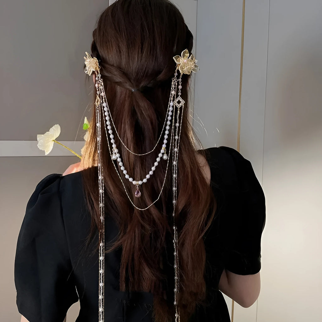 Gold women's hairpin with diamond flower design and long acrylic tassels