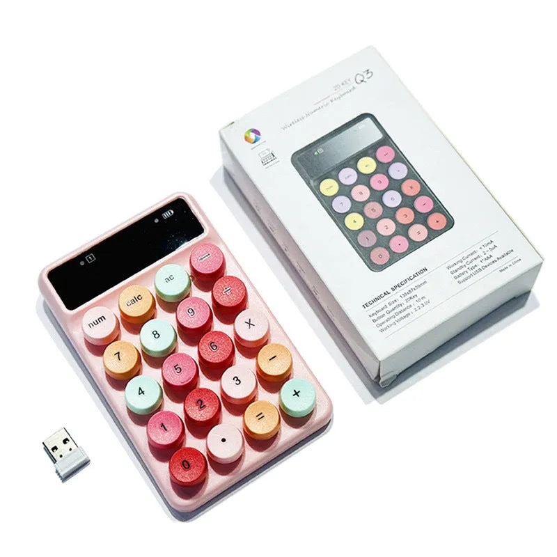 Mini portable wireless keyboard in macaron mixed colours on a desk.