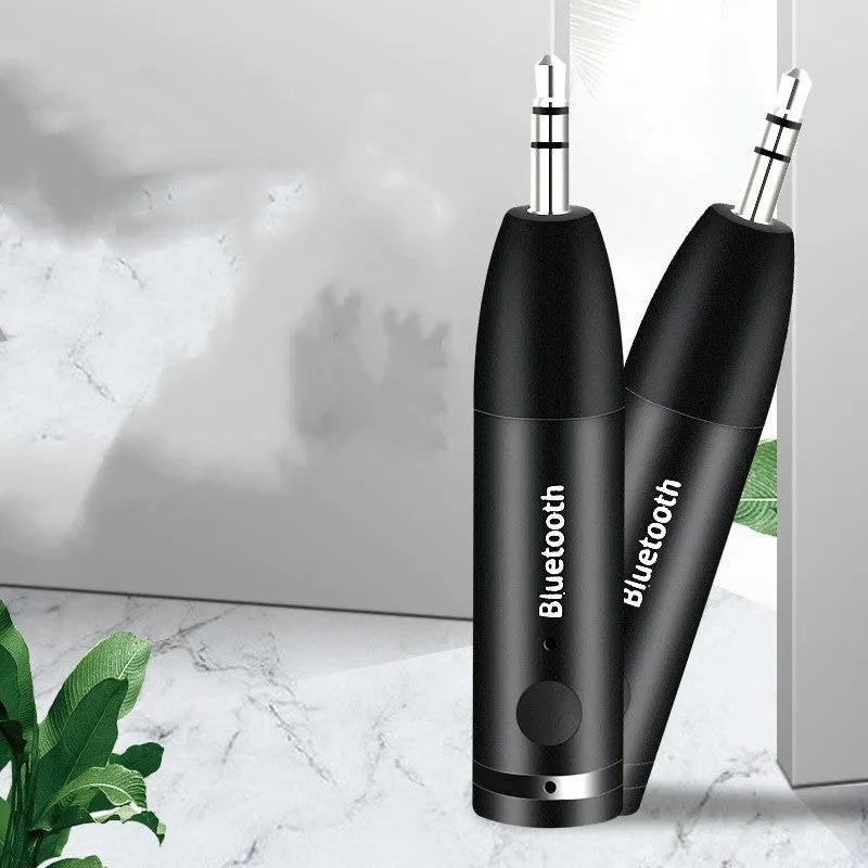 Black Bluetooth audio receiver with 3.5mm aux plug for car and home stereo wireless music streaming