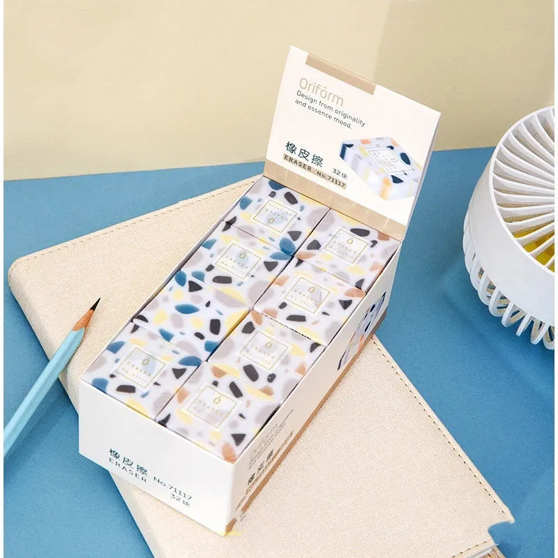 White rubber brick eraser for clean pencil mark removal.