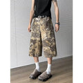 Yellow cotton denim cropped jeans with a snake camouflage pattern print.