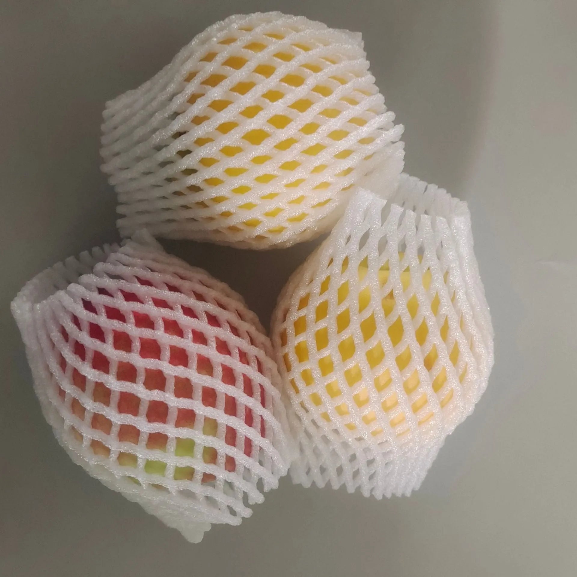 White foam fruit net cover shown with size options for shockproof fruit protection