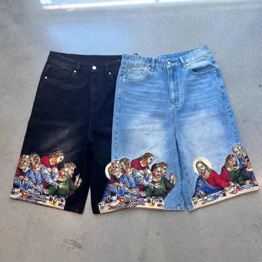Men's blue cotton tapered shorts with Jesus print on back pocket, showing tapered leg design