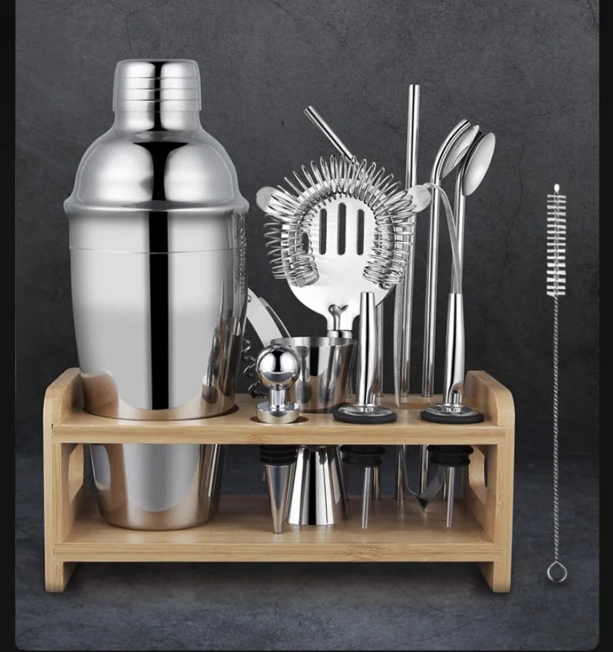 23-piece stainless steel cocktail bar set with acrylic European style mixers laid out on a table.