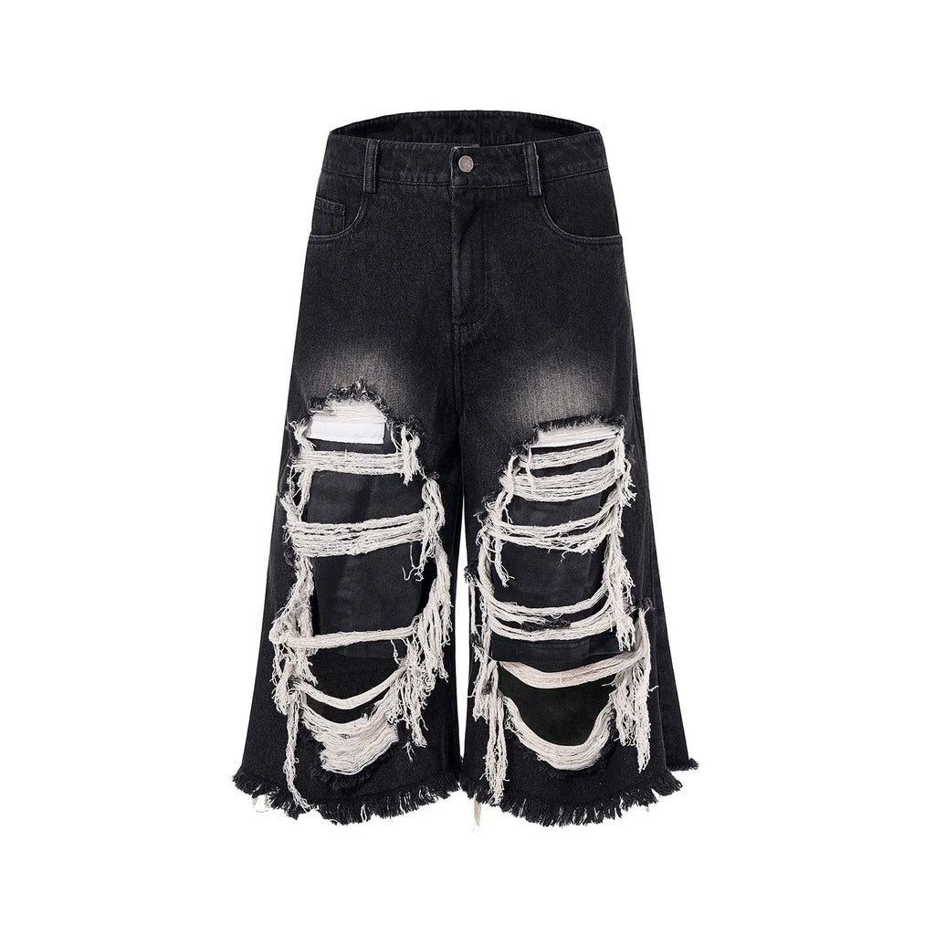 Black cropped wide-leg women's jeans with ripped patch details and mid-high waist