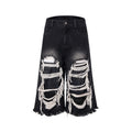 Black cropped wide-leg women's jeans with ripped patch details and mid-high waist