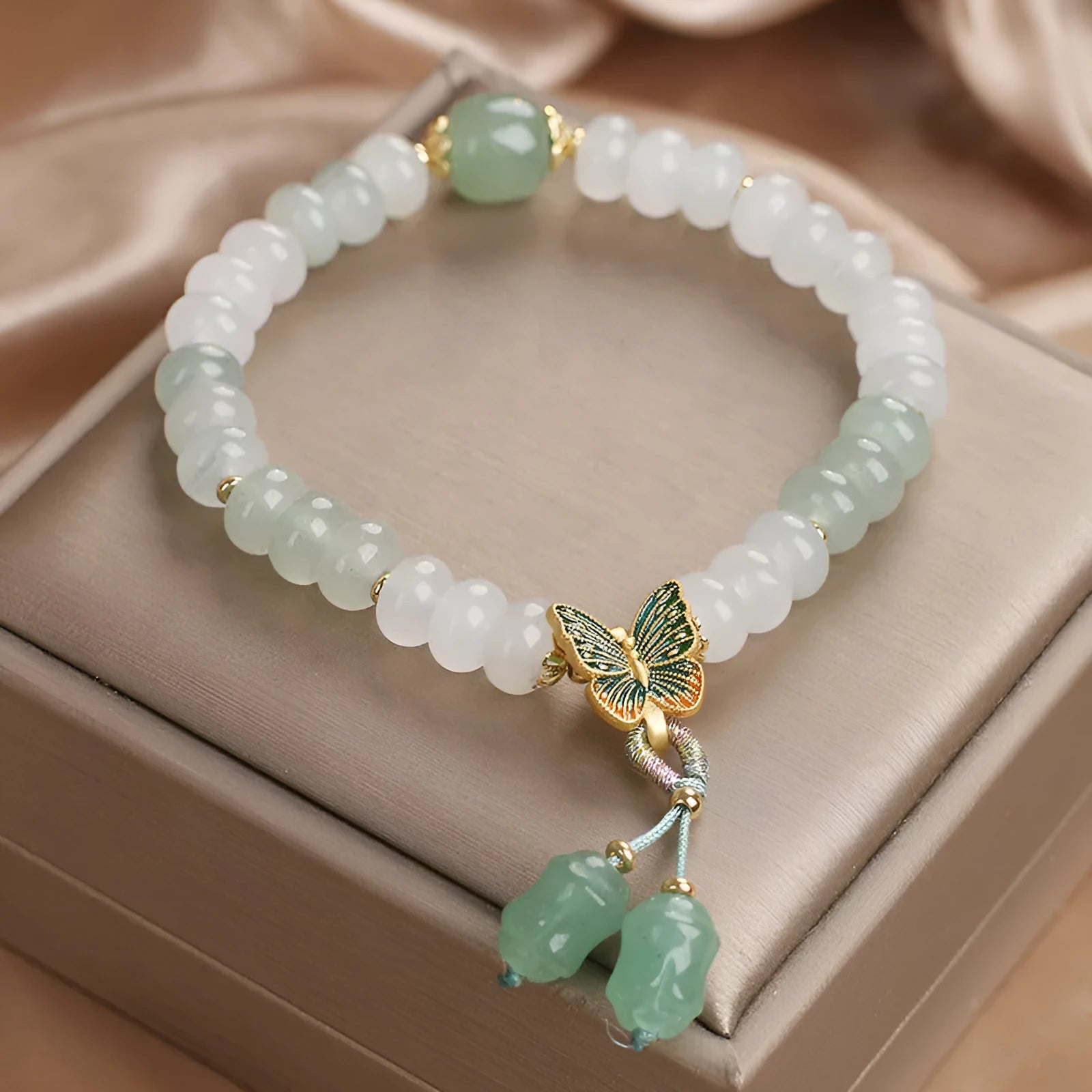 Green abacus bead bracelet for women with a butterfly tassel, pearls, and rhinestones