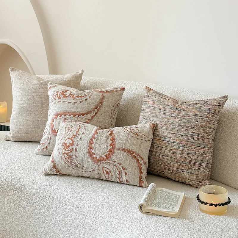 American-style jacquard paisley decorative pillow cover in amber tones on a sofa, showing square and rectangular size options.