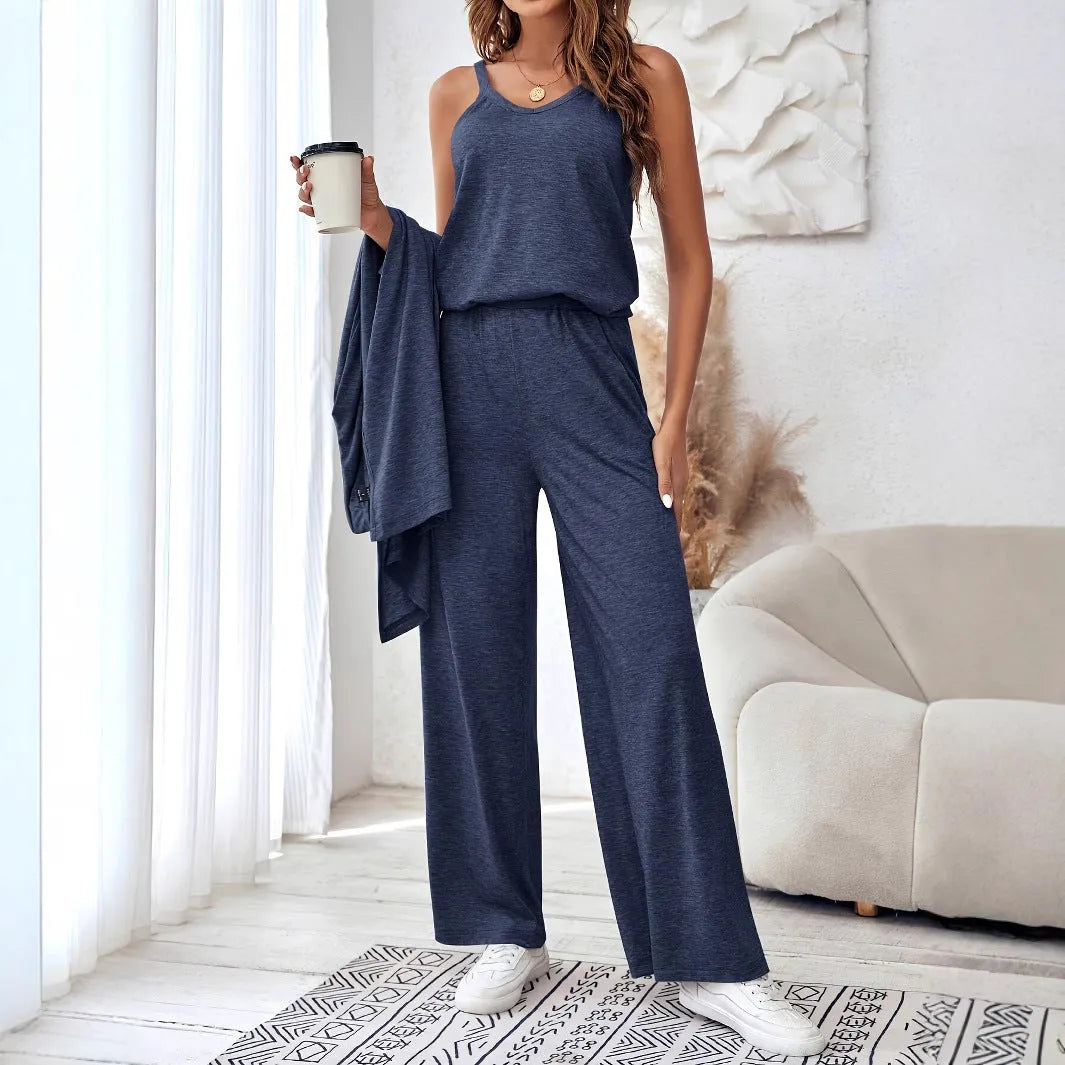 Blue women's three-piece casual suit set with sling top, long cardigan, and trousers on a hanger.
