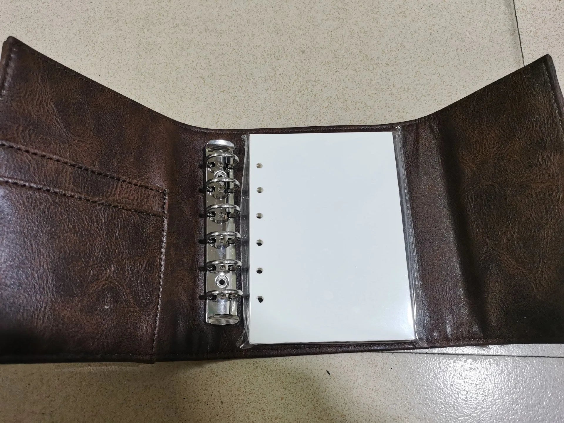 A7 brown retro leather buckle notebook with loose-leaf binding and PU cover