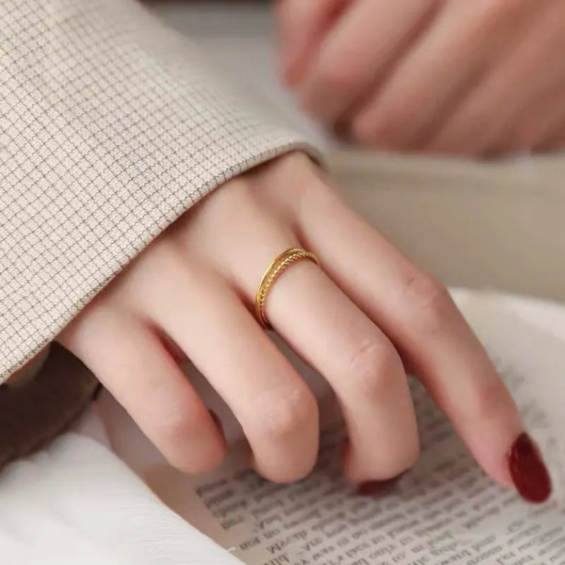 Women's brass gold plated ring showing twist, matte, and glossy simple bracelet styles