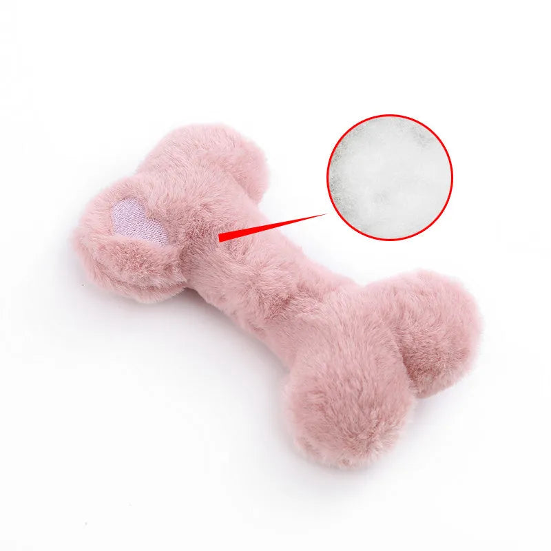 Blue, pink and yellow bone-shaped plush dog toys with squeaker for interactive play
