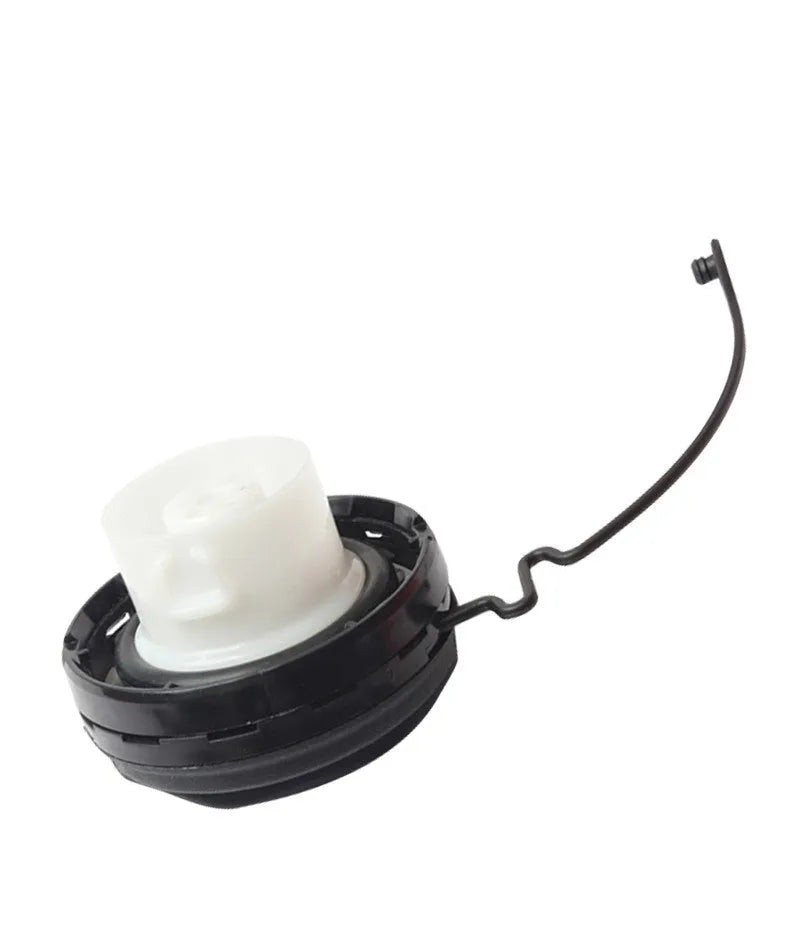 Snap-type fuel tank cap replacement part for Toyota vehicles.