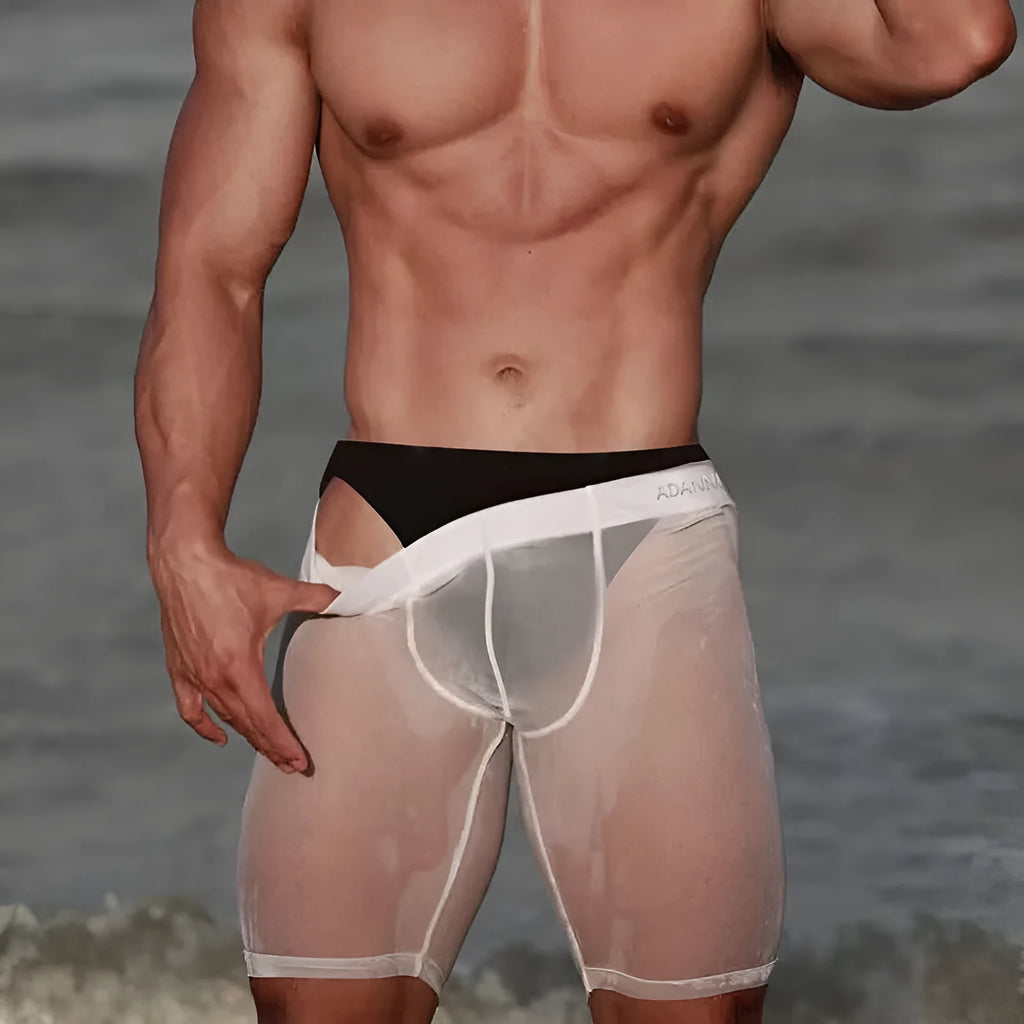 Man wearing black seamless knitted nylon mesh shorts with a close, hip-lifting fit.