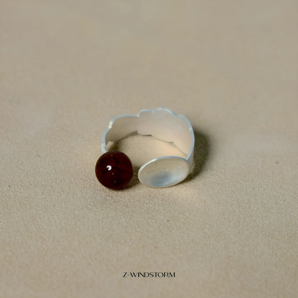 Silver tone alloy ring and bracelet set with a small stewed pork motif on diamond-shaped charms.