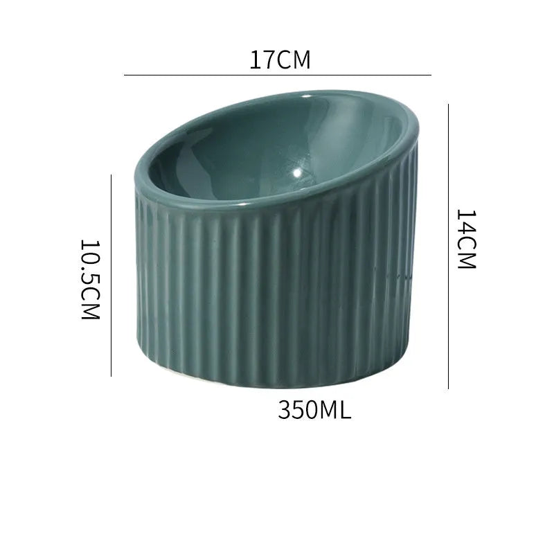 Ceramic elevated cat bowl in green colour, showing tilted design and raised feeding height.
