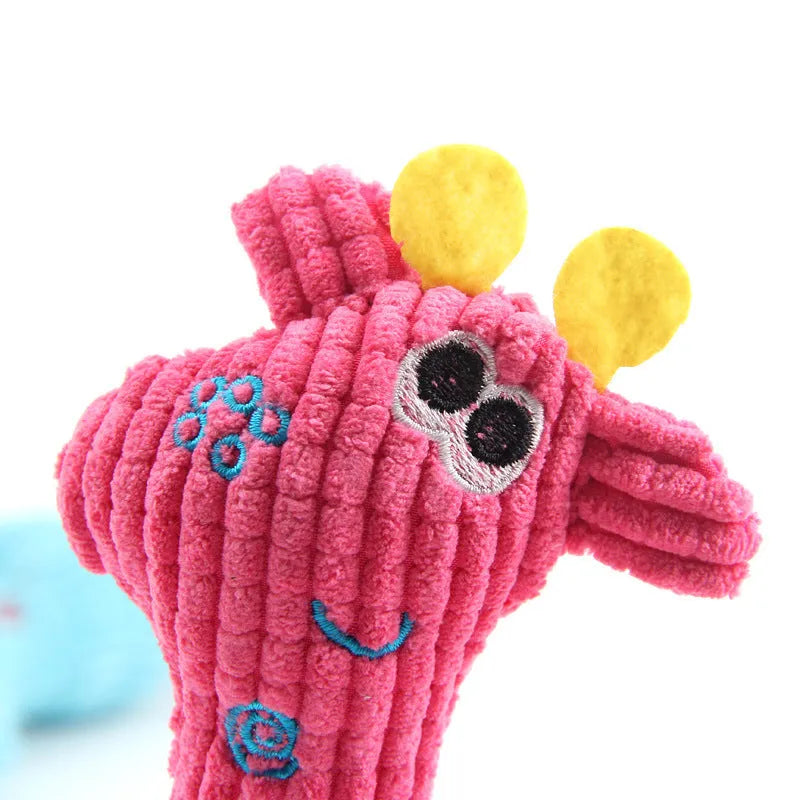 Blue plush deer-shaped dog toy with corn grain texture on a white background.