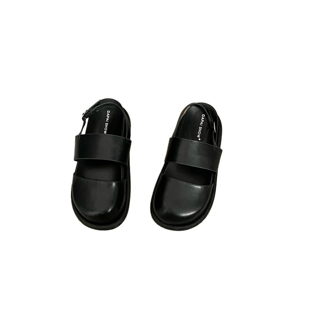 Retro brown platform sandals with a single ankle strap buckle and closed round toe.