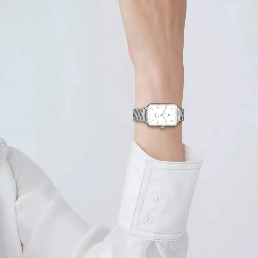 Women's rose gold or silver waterproof quartz watch with woven steel band and alloy case.
