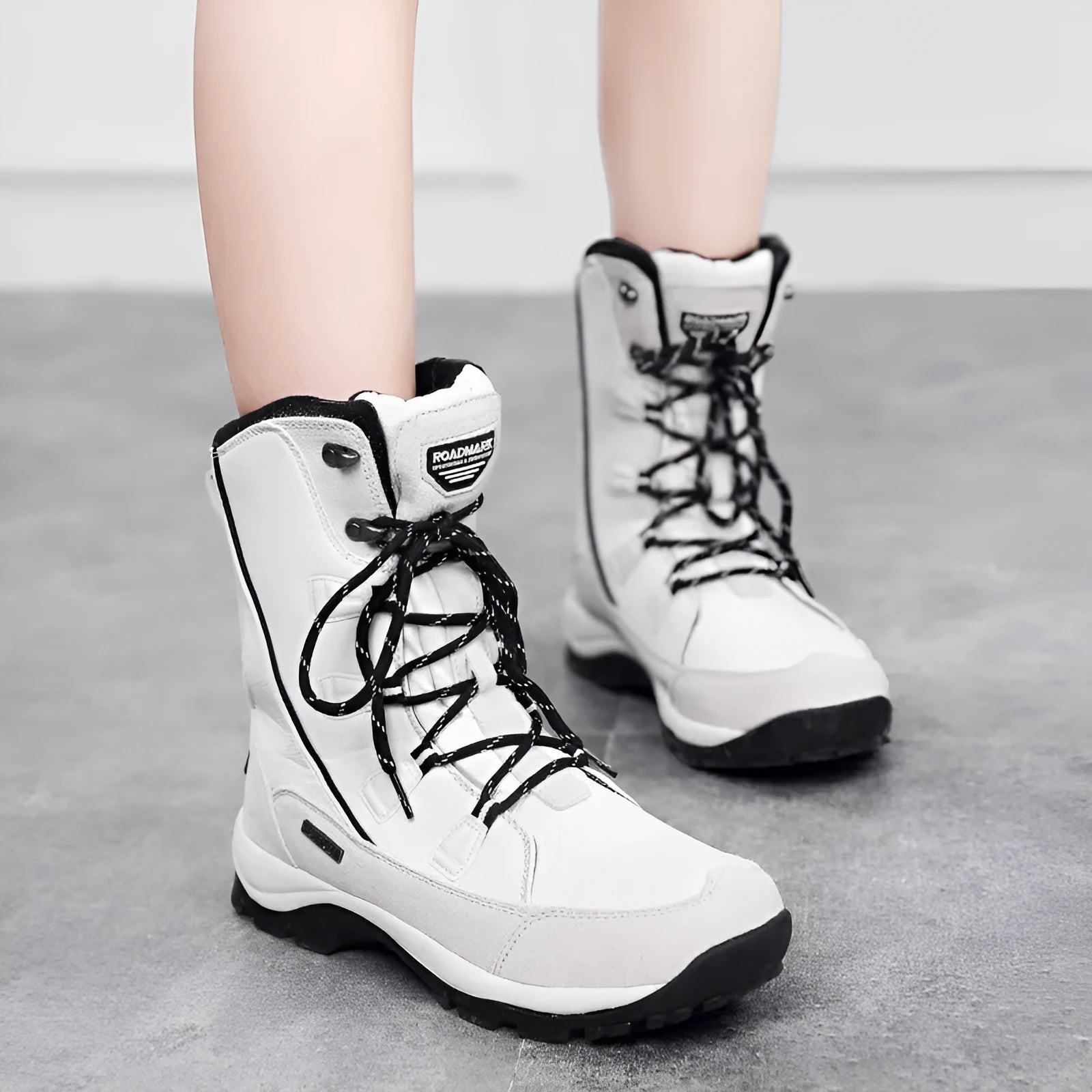 Women's genuine leather mid-calf snow boots in black with round toe and rubber non-slip sole
