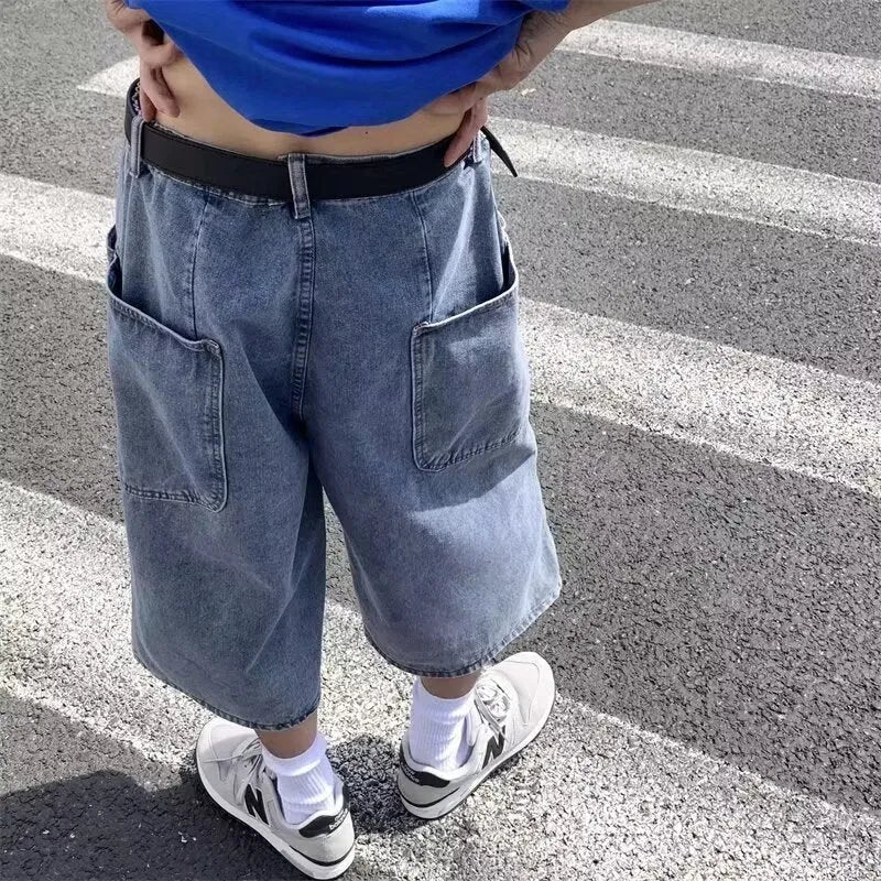 Men's blue high-waisted denim pirate shorts with a cropped, straight leg and zipper fly.