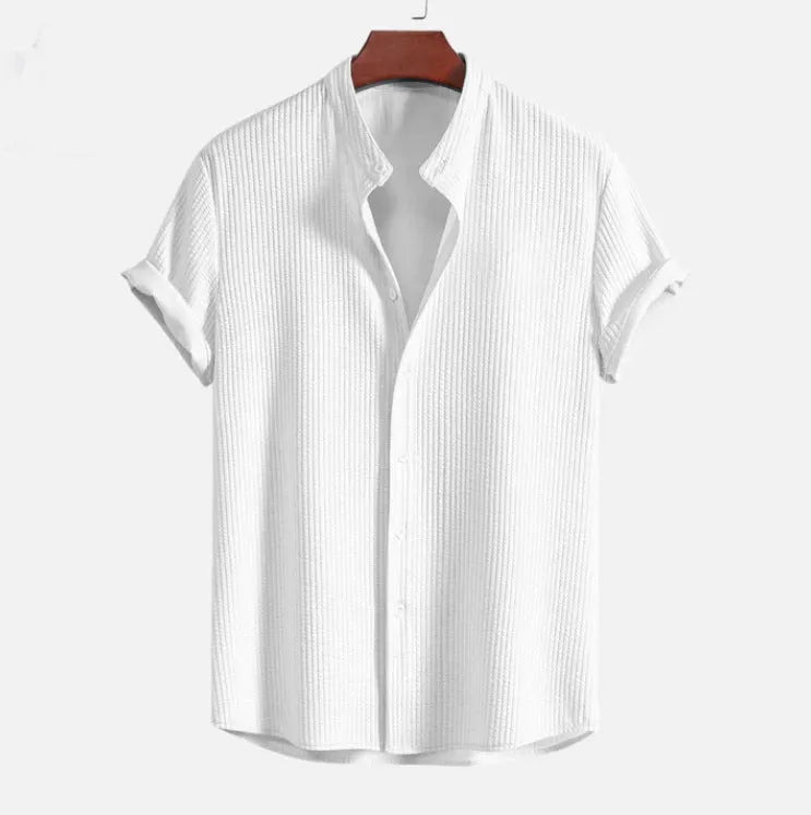 Man wearing a loose-fitting short sleeve polyester shirt in light blue, showcasing the casual summer style.