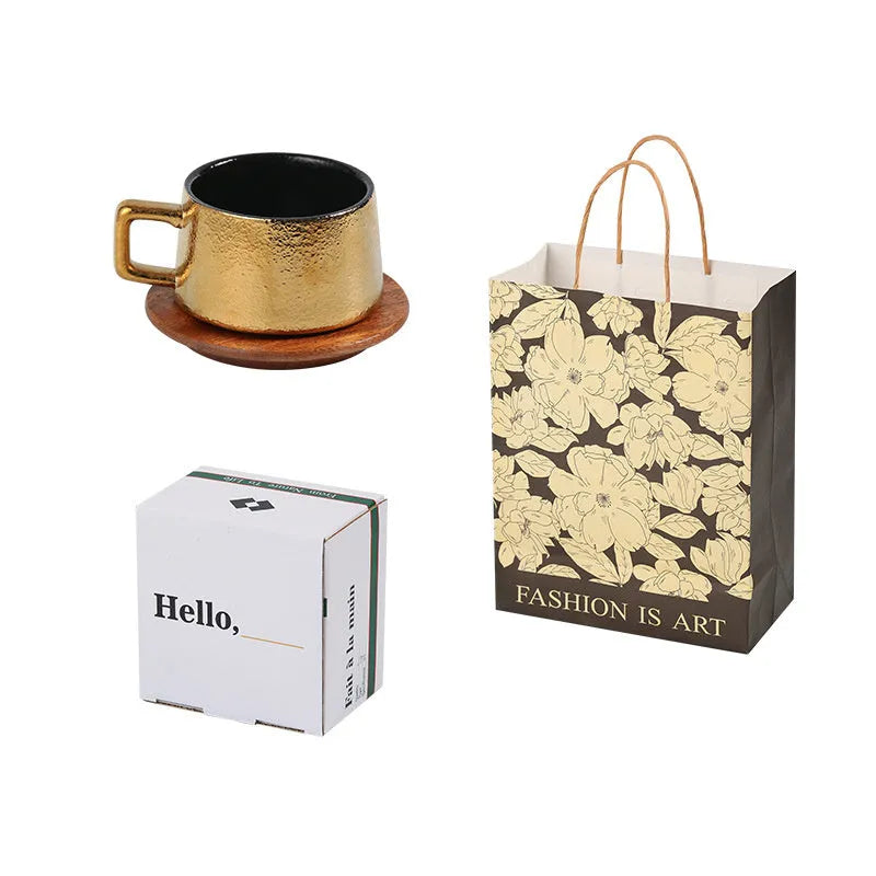 Gold and silver plated gift box next to a 250ml solid colour coffee travel mug.