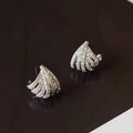 Pair of geometric line design earrings with platinum electroplated finish on zircon.