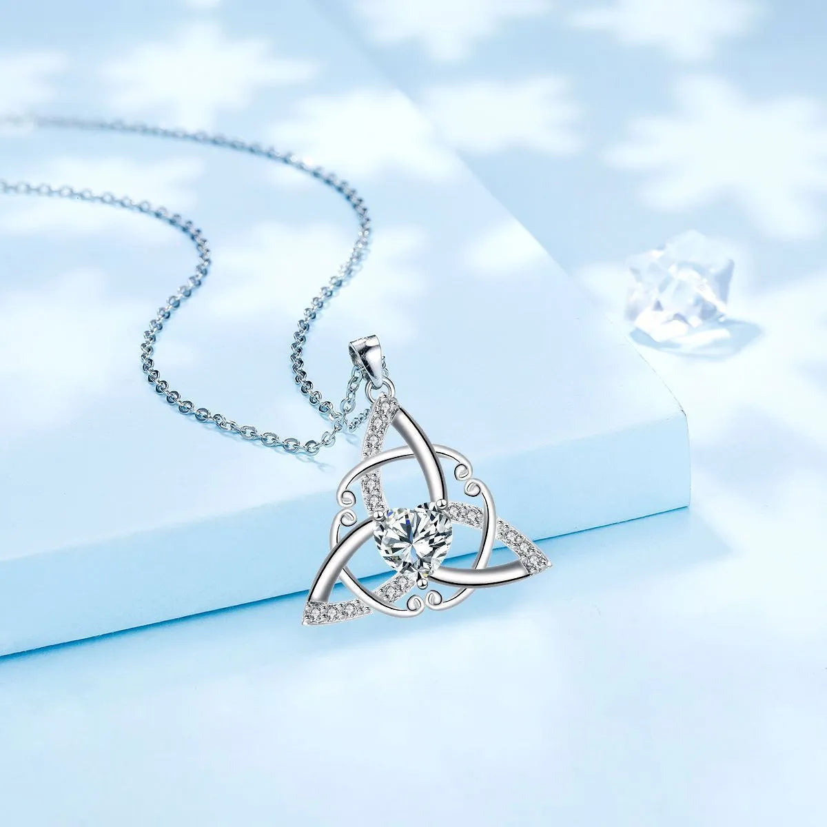 A geometric Celtic knot pendant necklace for women in an electroplated finish.