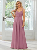 A sleeveless light green women's dress with a pleated A-line long skirt on a mannequin.