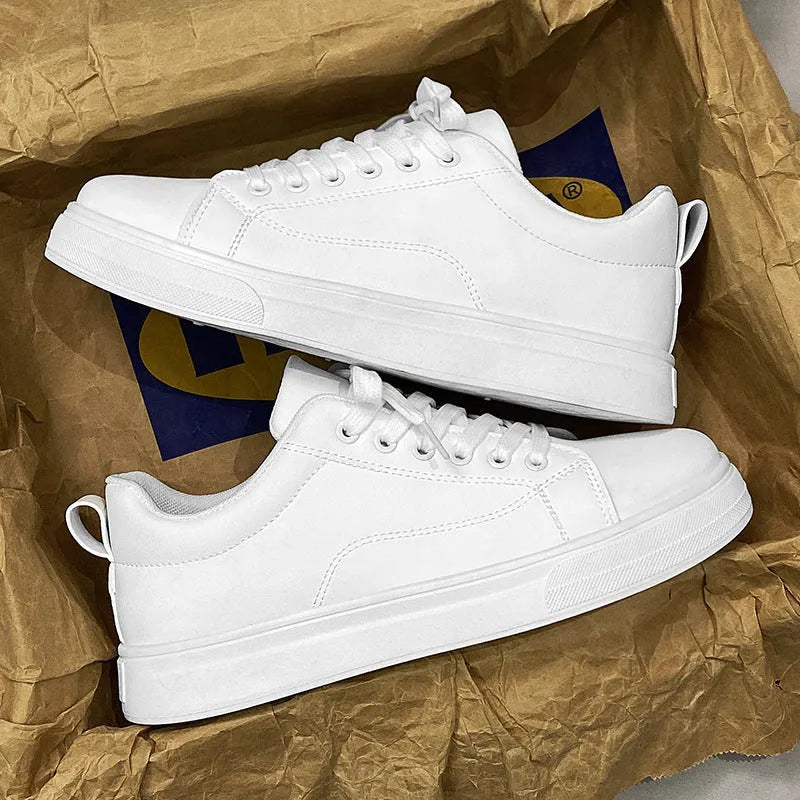 Men's low-top Korean-style sneakers in white, black, or black and white with a round toe and rubber sole.