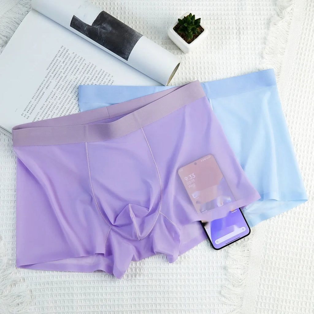 Men's ultra-thin Ice Silk seamless boxer briefs in pink on a white background