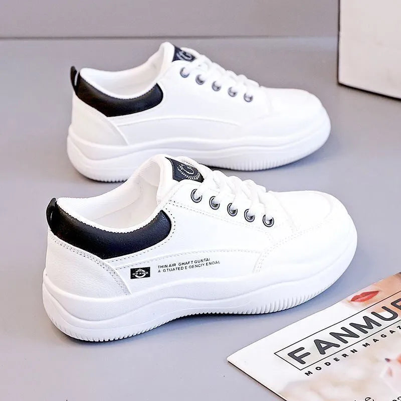 Women's white Korean style low top pumps with round head, cross straps, and rubber sole