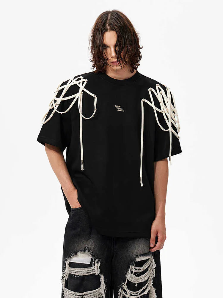 Black women's t-shirt with decorative ribbon trim padded shoulders and rivet detailing