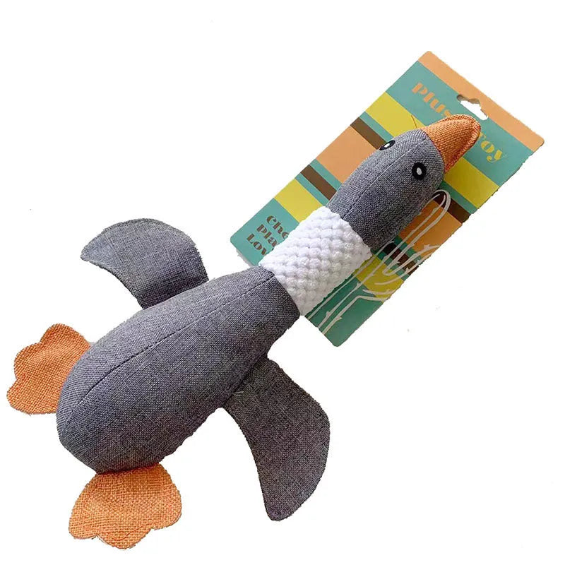 Blue, green or grey duck-shaped dog plush toy with squeakers, measuring 33 cm
