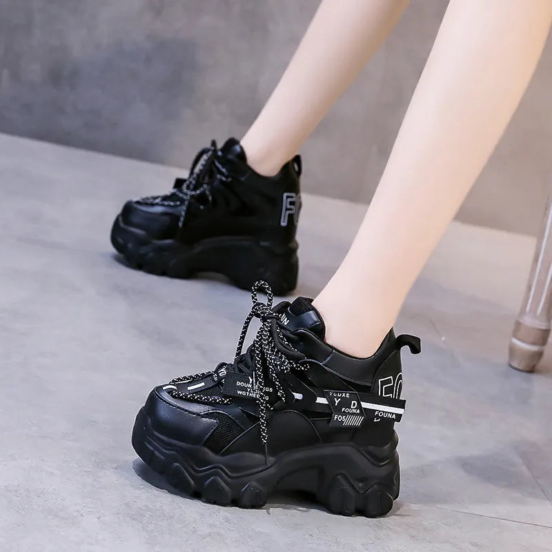 White women's mesh platform sports shoes with cross-strap detail and rubber sole.