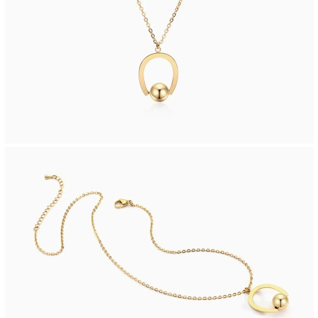 Gold or silver geometric stainless steel necklace on an adjustable cross chain.
