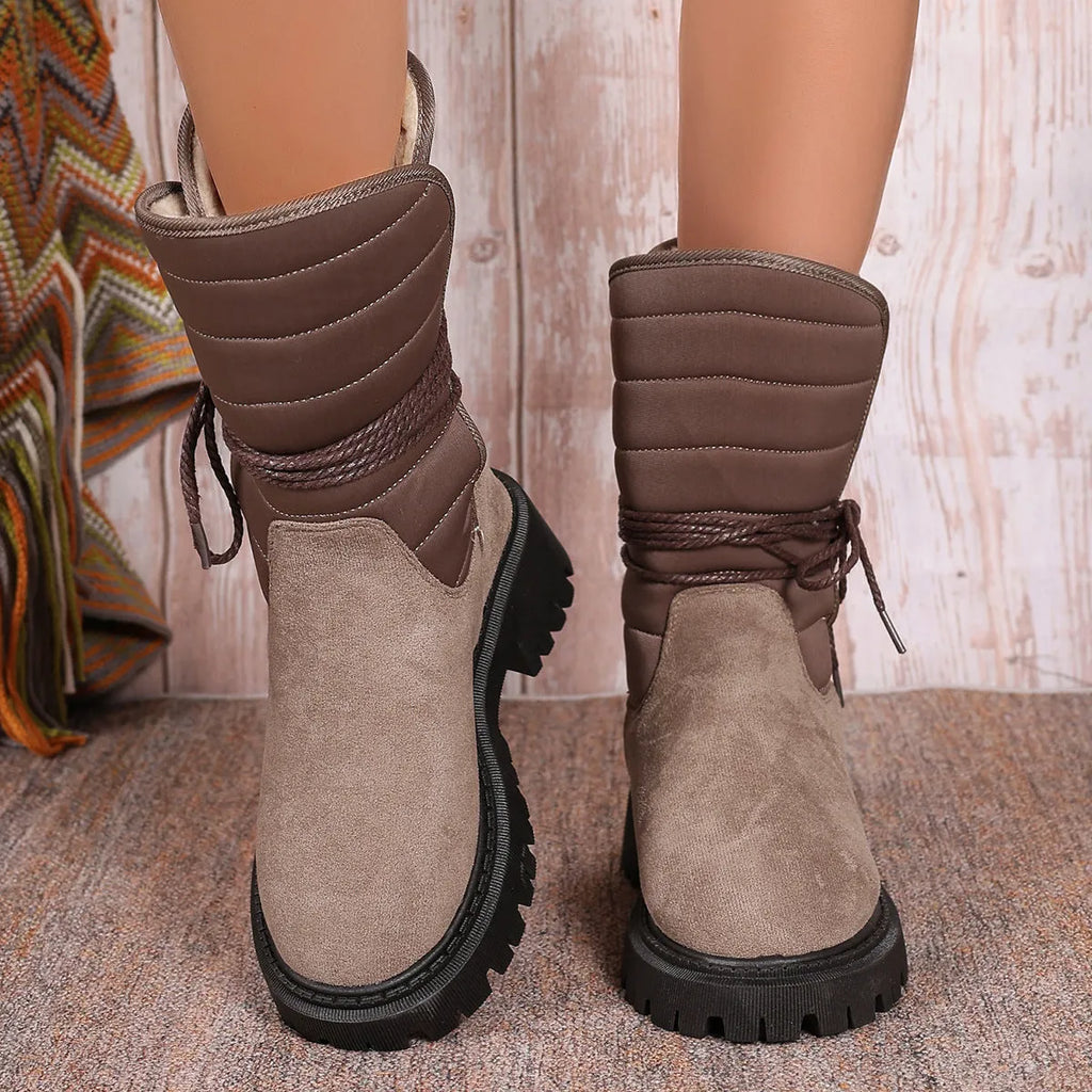 Women's black suede snow boots with chunky heel, lace-up front, and fleece lining.