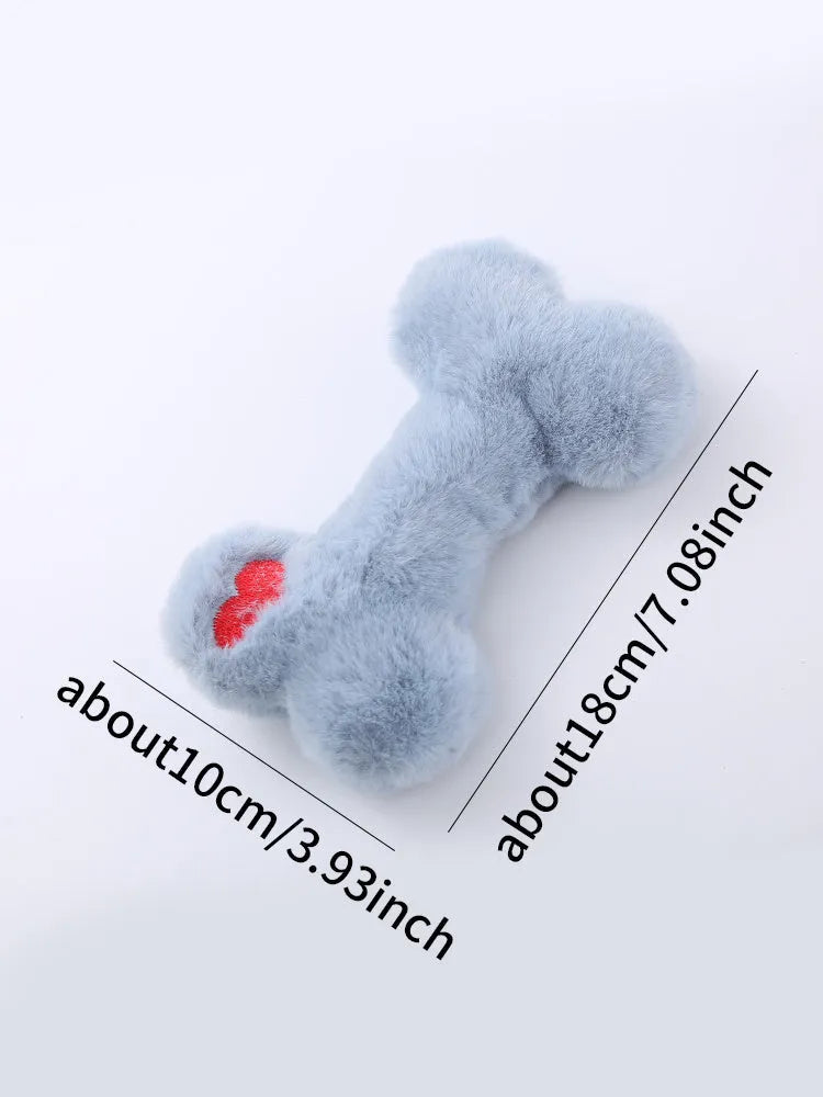 Blue, pink and yellow bone-shaped plush dog toys with squeaker for interactive play