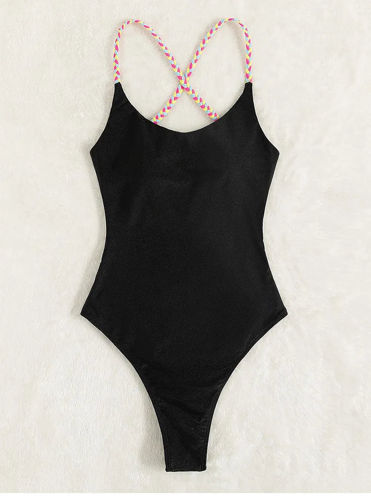 Black backless one-piece swimsuit on a white background