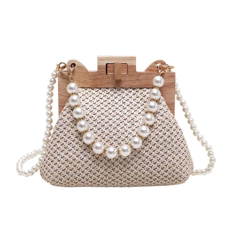 Women's straw shoulder bag with pearl chain detail in horizontal square shape