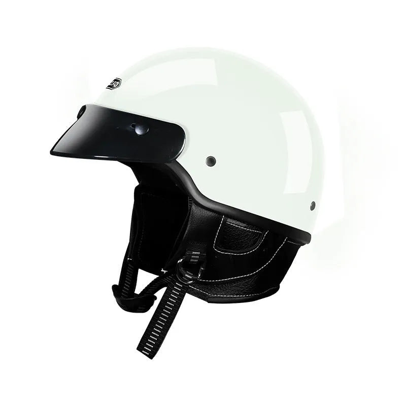 Retro style motorcycle helmet shown in cement grey colour on a solid background