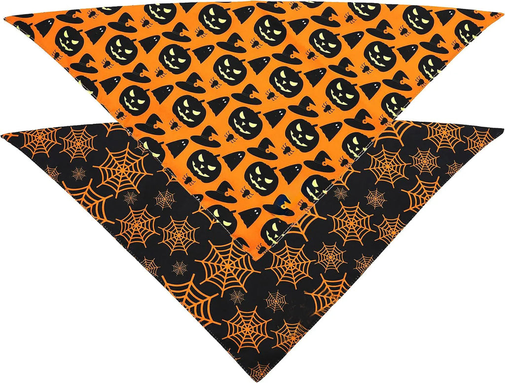 Black and orange reversible Halloween dog bandana with pumpkin and spider web patterns, showing adjustable fastening.