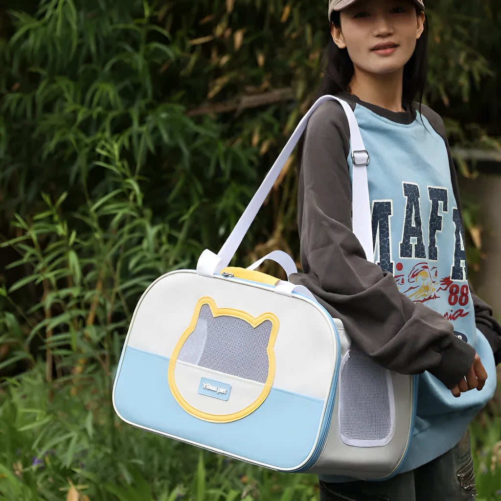 Blue foldable oxford cloth cat carrier backpack shown in outdoor setting